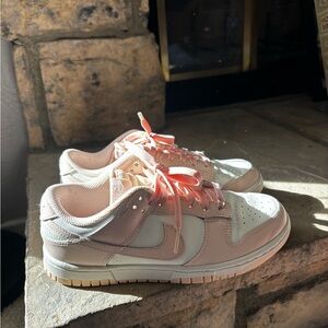 Nike dunks in pale pink